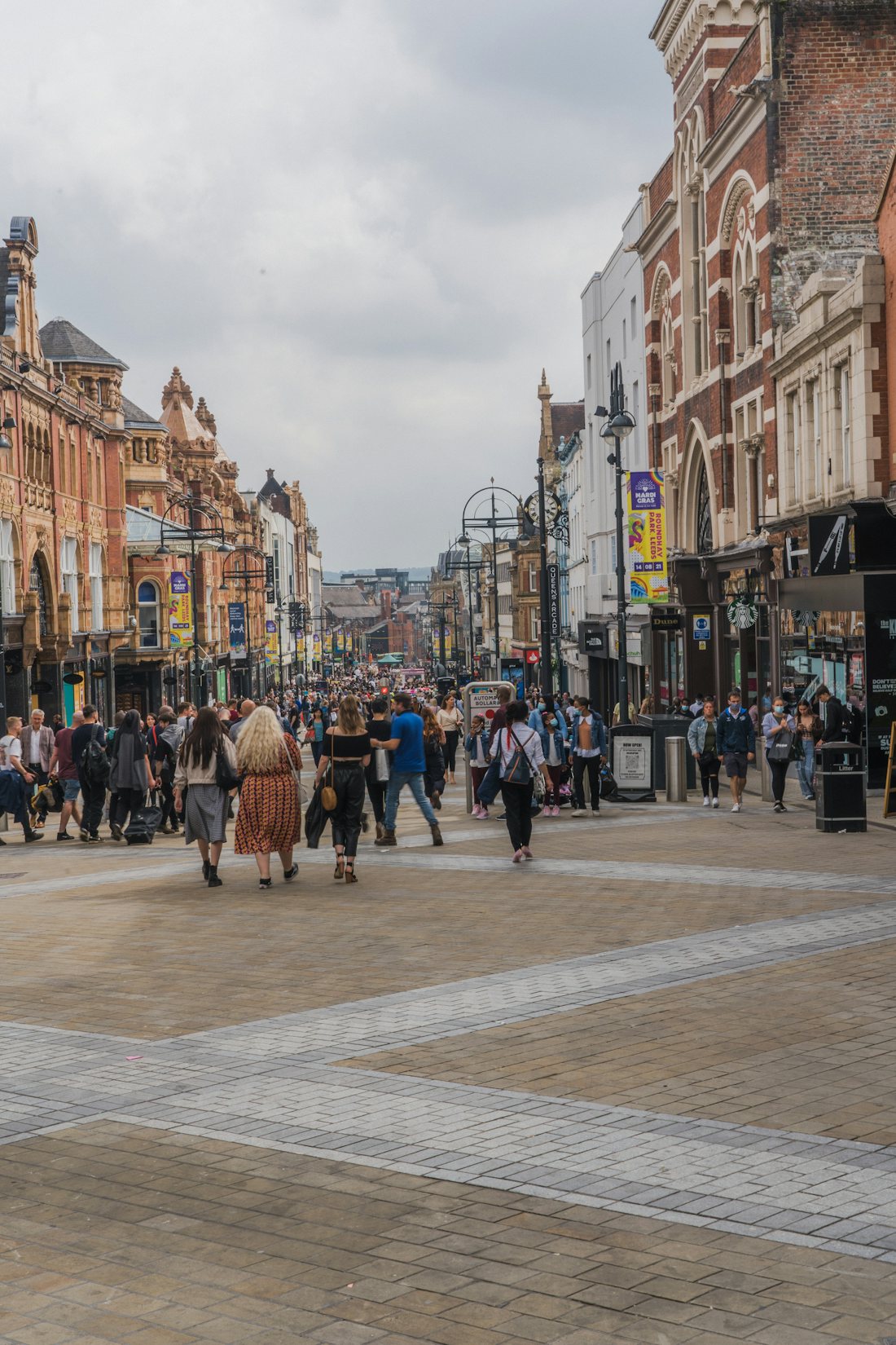 Busy pedestrianised northern high street lined with shops