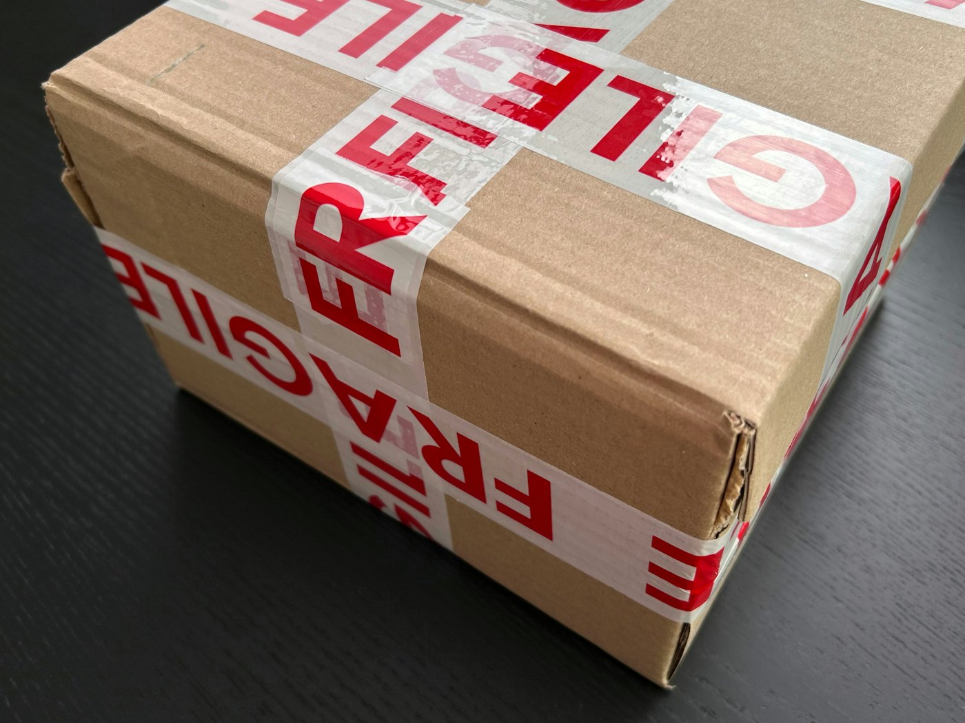 Parcel sealed with fragile tape ready for dispatch