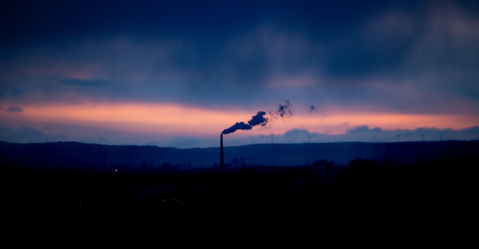 Industrial chimney silhouetted against a dusk sky on Teesside
